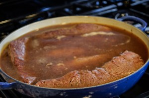 Place the meat back in the pan. The tops of the short ribs should just be sticking out of the liquid.