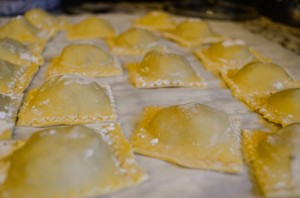 The cut ravioli hold very well when frozen. Use layers of parchment paper to keep them from sticking together.